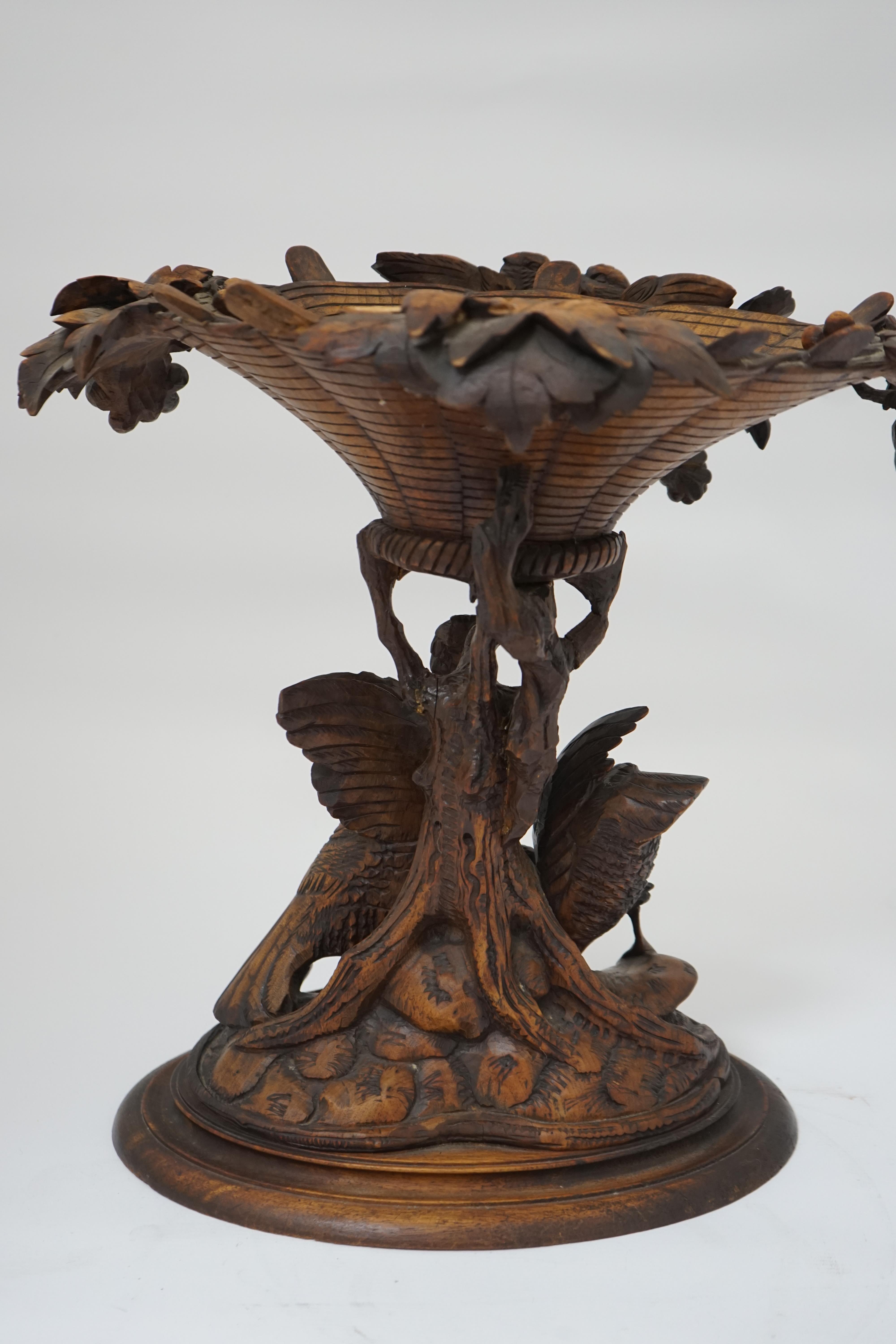 A 19th century Black Forest carved wood centrepiece